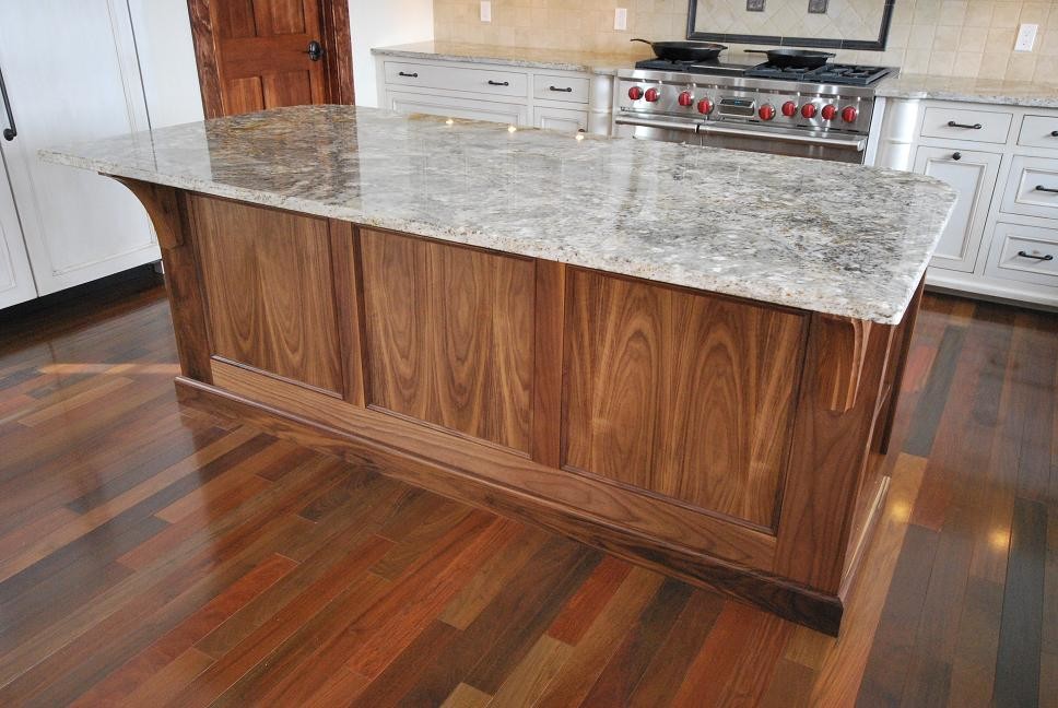 Inspiration for a mid-sized craftsman l-shaped medium tone wood floor eat-in kitchen remodel in Boston with recessed-panel cabinets, medium tone wood cabinets, granite countertops and an island