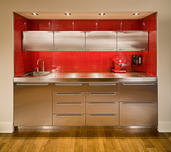 Photo of a kitchen in Seattle with an integrated sink, stainless steel cabinets, stainless steel benchtops, red splashback and matchstick tile splashback.