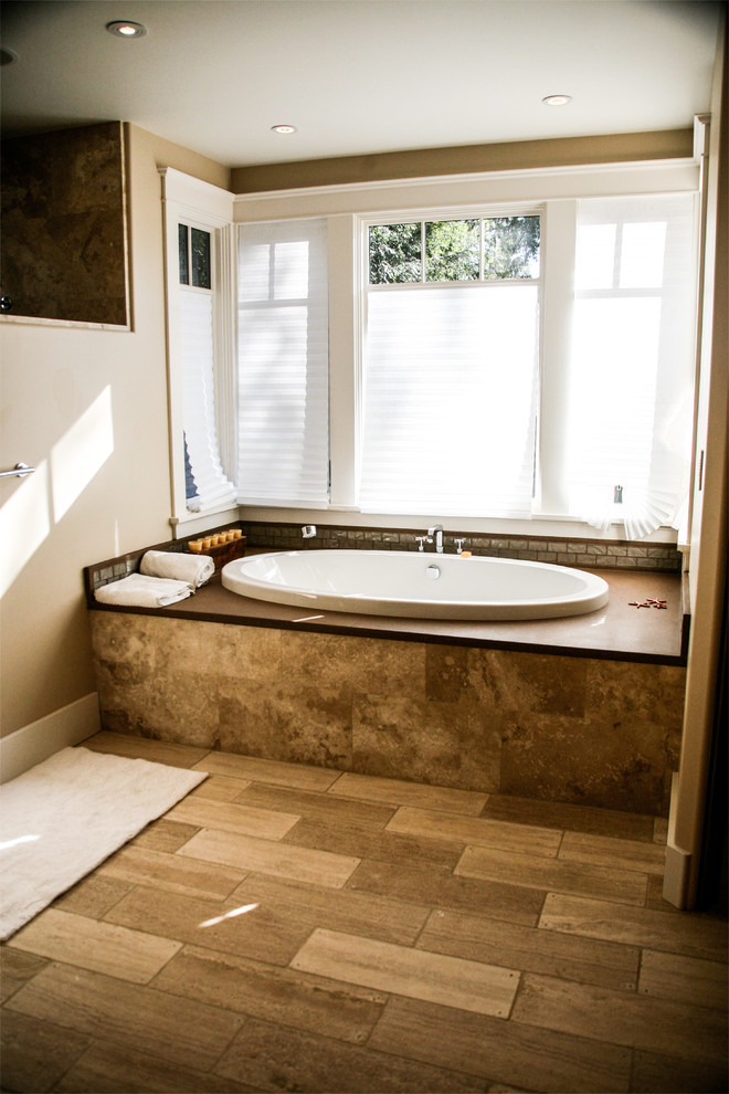 Design ideas for a mid-sized traditional master wet room bathroom in San Francisco with beaded inset cabinets, medium wood cabinets, an alcove tub, a two-piece toilet, brown tile, travertine, beige walls, travertine floors, a drop-in sink, granite benchtops, brown floor and an open shower.