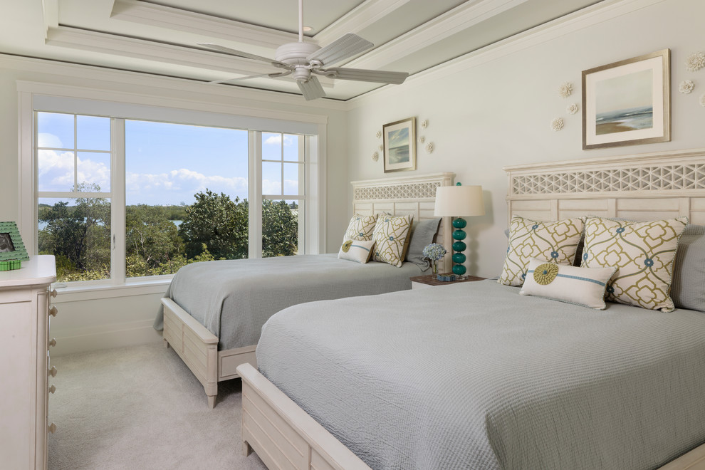 Mid-sized beach style guest bedroom in Miami with white walls, carpet and grey floor.