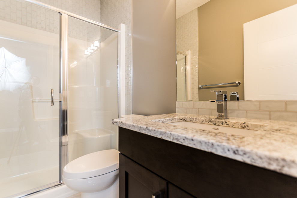 Transitional home design photo in Edmonton