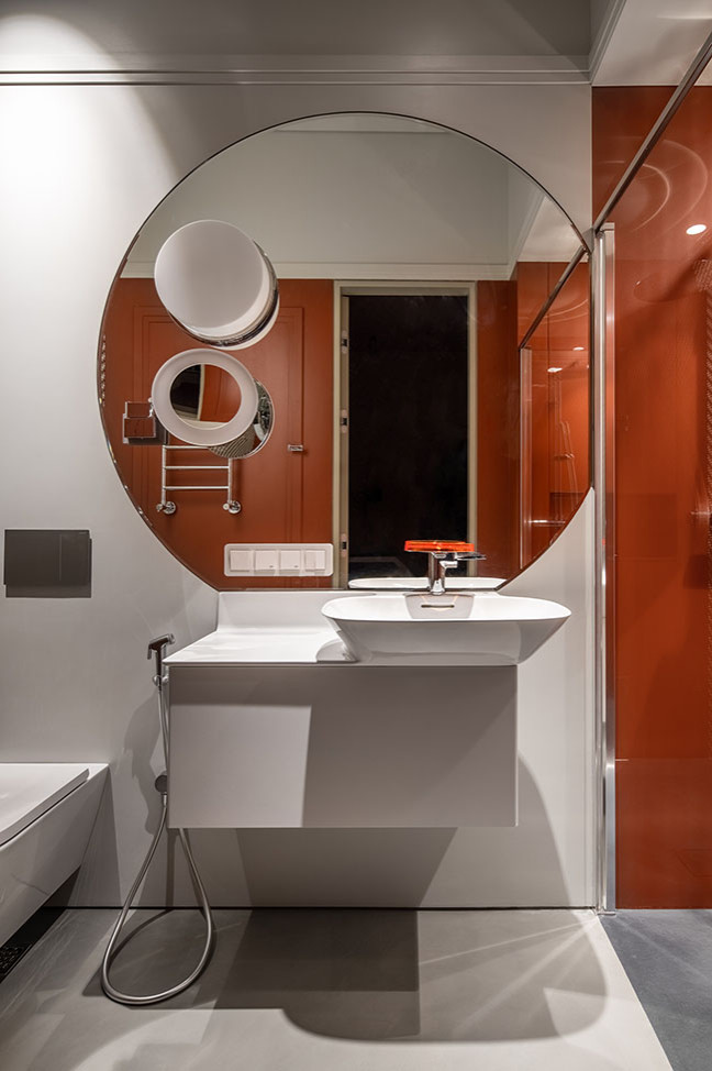 Photo of a large traditional bathroom in Sydney with white walls, medium hardwood floors, multi-coloured floor, vaulted and panelled walls.