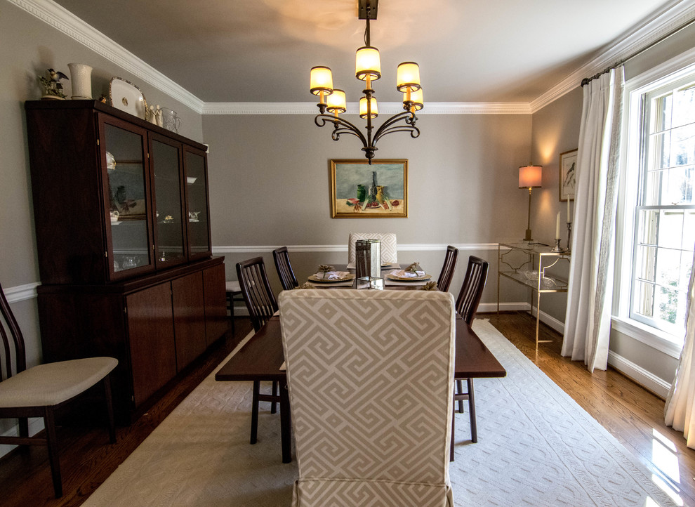 Design ideas for a transitional dining room in Baltimore with beige walls and dark hardwood floors.