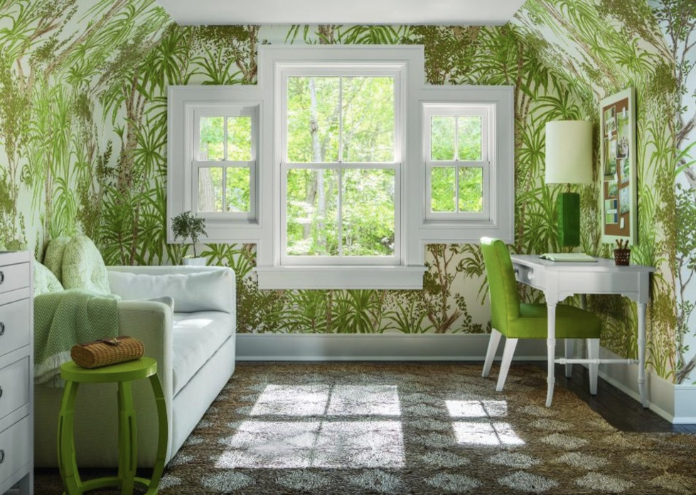 Inspiration for a mid-sized tropical home office in Nashville with green walls, carpet, no fireplace, a freestanding desk and brown floor.
