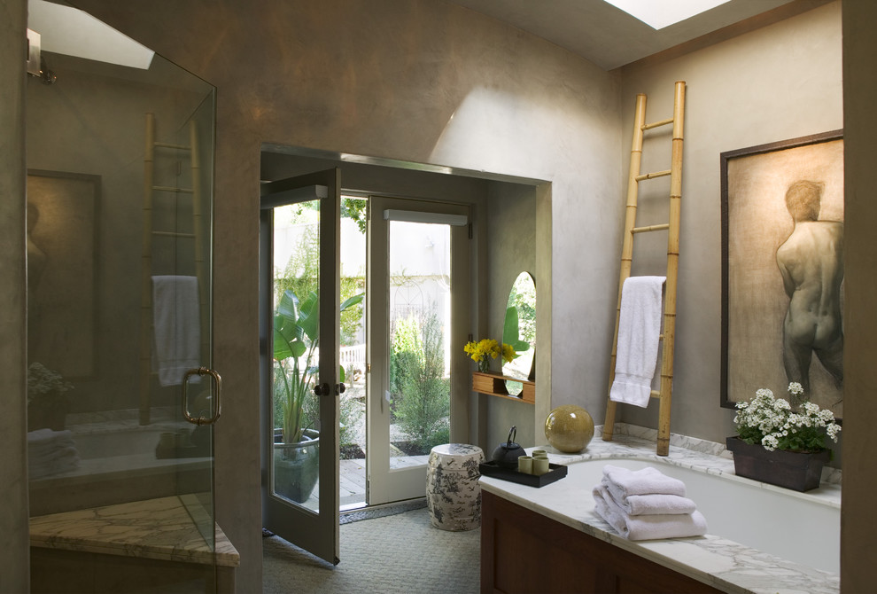 Large eclectic master bathroom in San Francisco with an undermount tub, a corner shower, medium wood cabinets, a two-piece toilet, gray tile, grey walls, an undermount sink, marble benchtops, beige floor and a hinged shower door.