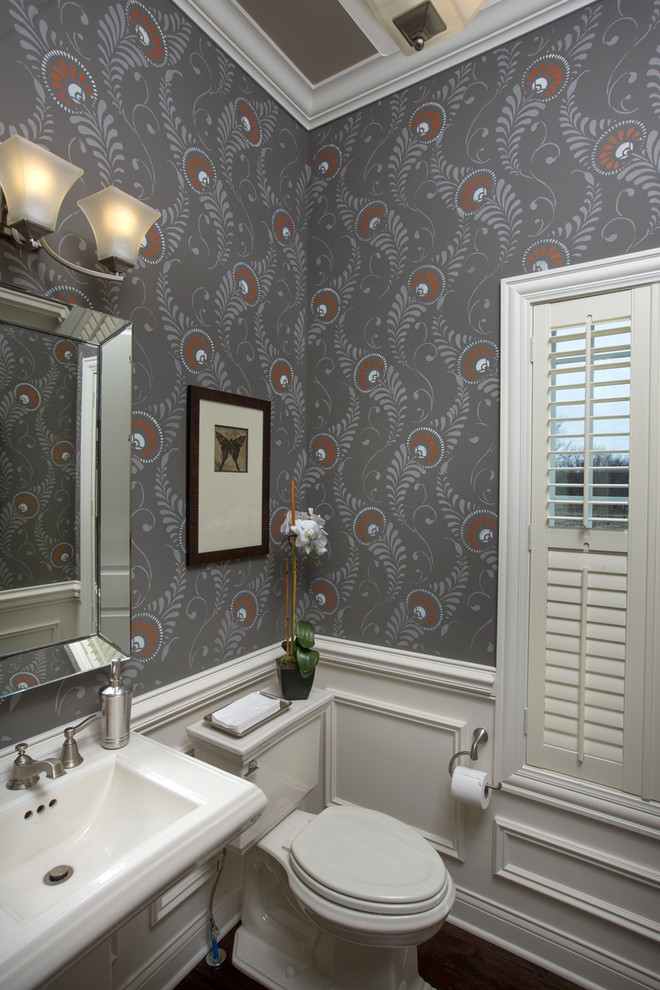 Photo of a mid-sized transitional powder room in Columbus with a pedestal sink and grey walls.