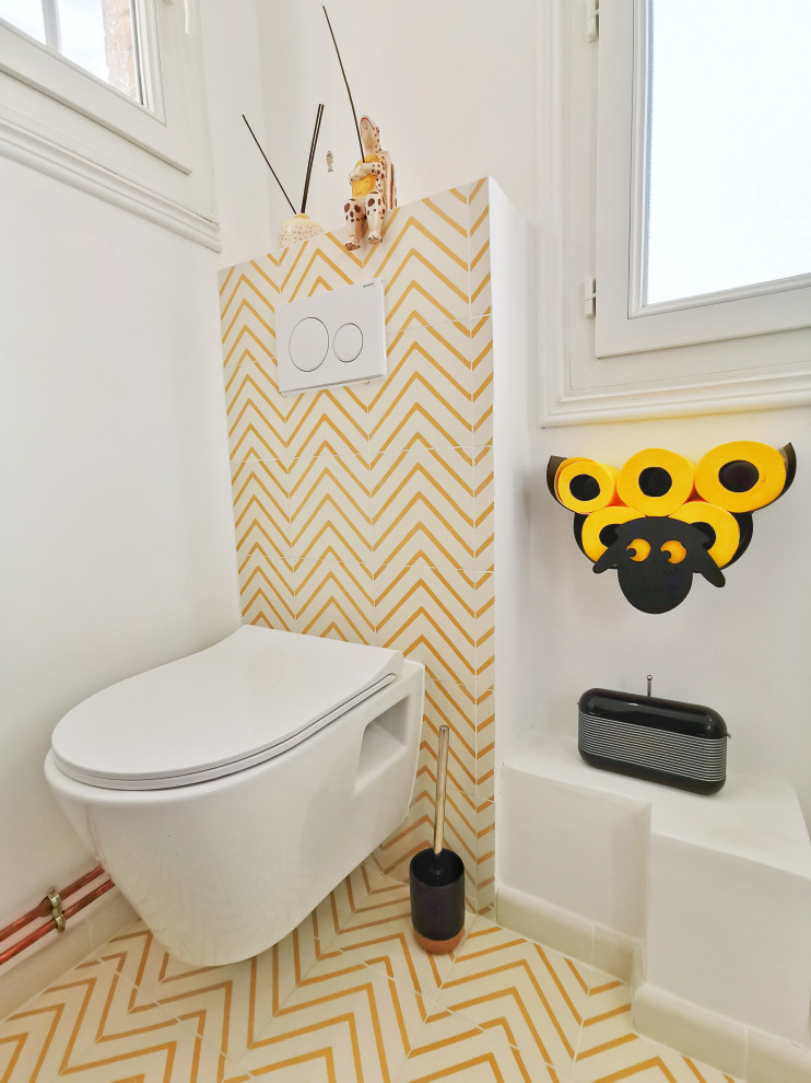 Inspiration for a small contemporary cloakroom in Paris with flat-panel cabinets, white cabinets, a wall mounted toilet, white tiles, matchstick tiles, white walls, cement flooring, a submerged sink, tiled worktops, yellow floors, yellow worktops and a floating vanity unit.