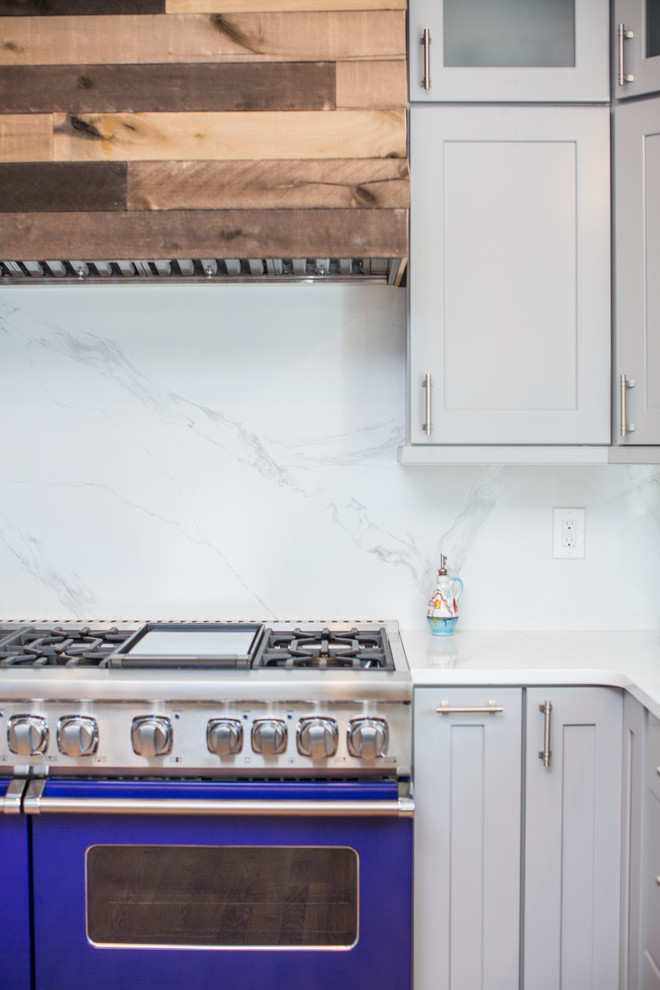 Eat-in kitchen - huge transitional u-shaped eat-in kitchen idea in Denver with shaker cabinets, gray cabinets, quartz countertops, blue backsplash, no island and white countertops