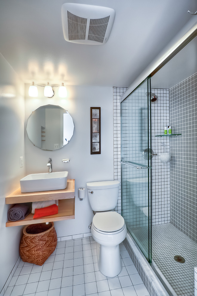 This is an example of a contemporary bathroom in DC Metro with wood benchtops, an alcove shower, a two-piece toilet, white tile and ceramic tile.
