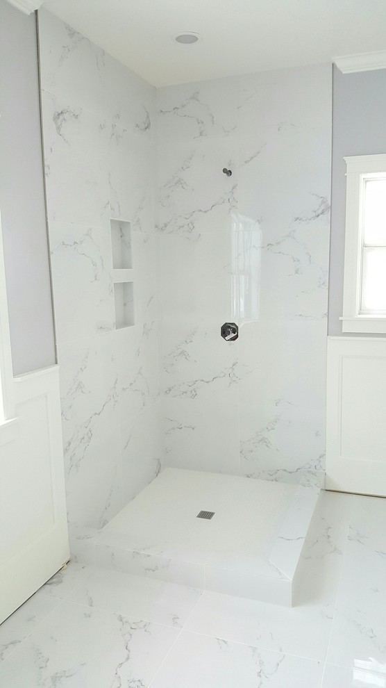 Mid-sized transitional 3/4 white tile and stone slab marble floor and white floor corner shower photo with gray walls