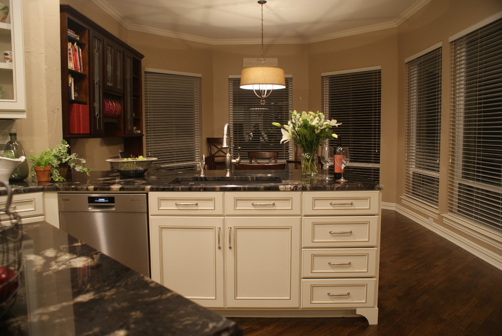 Kitchen - large transitional medium tone wood floor kitchen idea in Dallas with an undermount sink, flat-panel cabinets, white cabinets, granite countertops, ceramic backsplash, stainless steel appliances, beige walls and an island