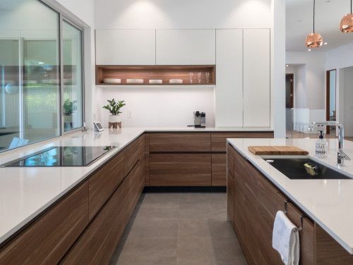 Contemporary Canadian kitchen with engineered wood cabinets and white quartz countertops