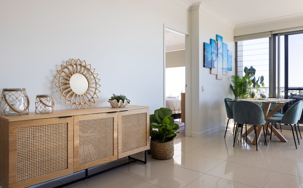 Inspiration for a small beach style open plan dining in Sunshine Coast with porcelain floors.