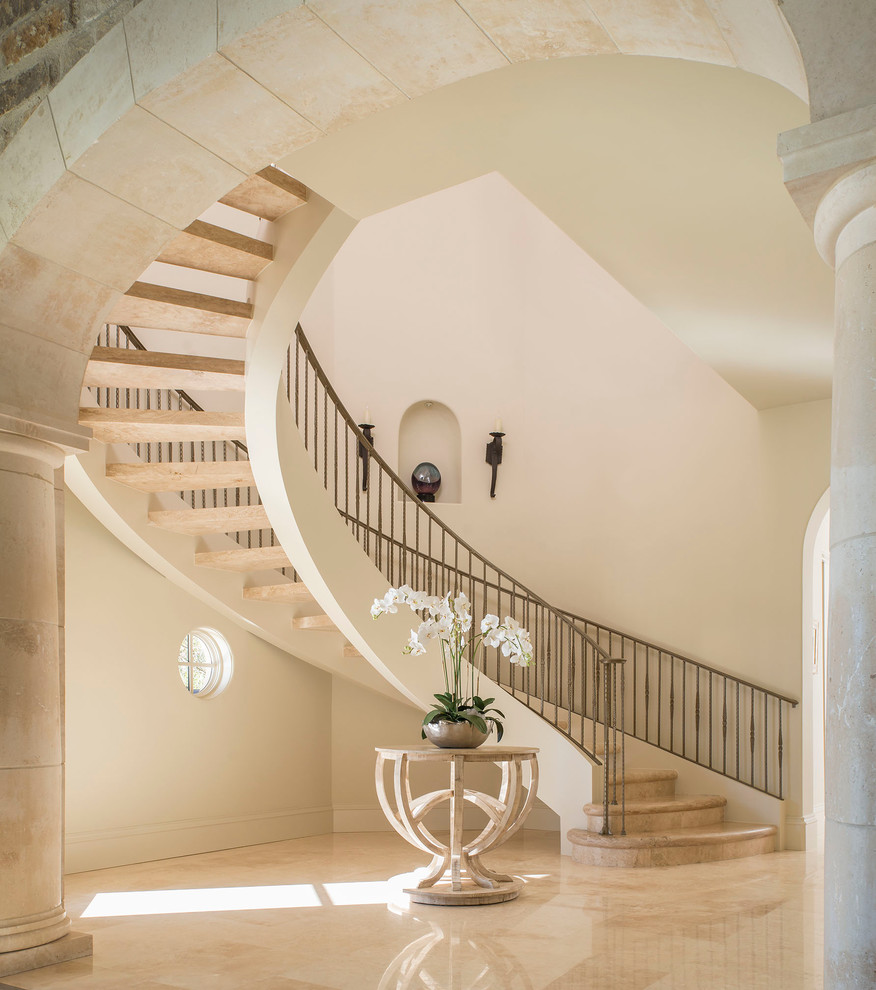 Design ideas for a traditional curved staircase in Dallas with open risers.