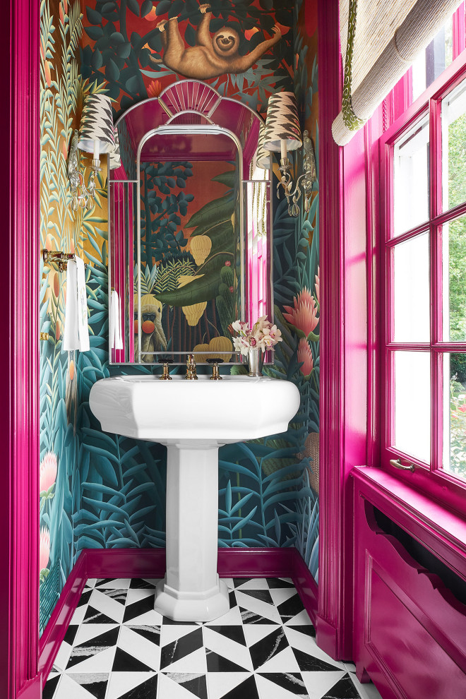 This is an example of a mid-sized eclectic powder room in Chicago with white cabinets, marble floors, engineered quartz benchtops, black floor, white benchtops, multi-coloured walls, a pedestal sink and wallpaper.