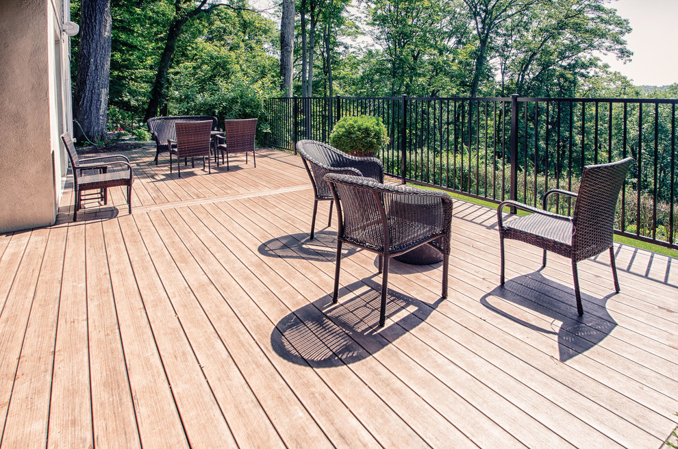 Large transitional backyard deck photo in New York with no cover