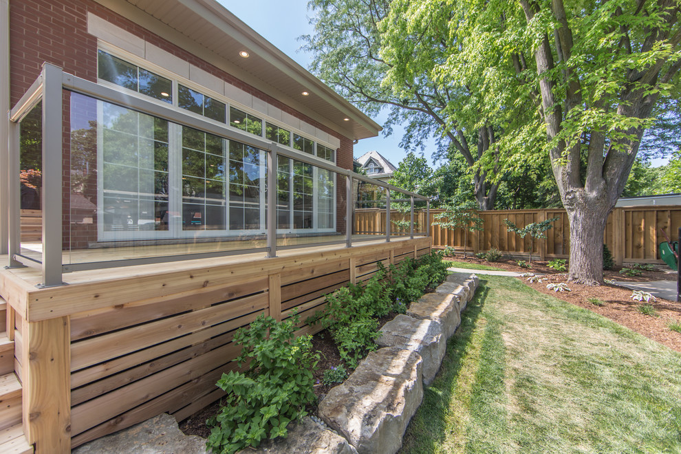 Inspiration for a large modern backyard deck in Toronto with no cover.
