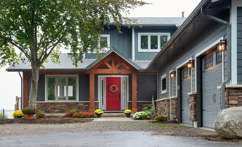 Inspiration for a large traditional two-storey grey exterior in Toronto with concrete fiberboard siding and a gable roof.