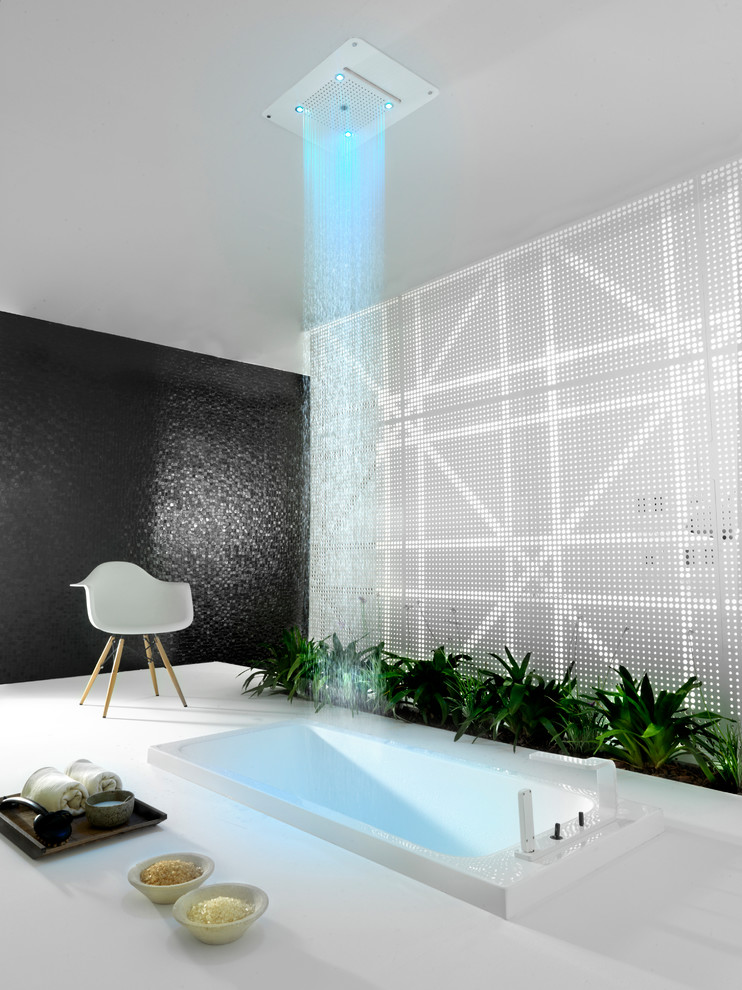 This is an example of a contemporary bathroom in Other with a drop-in tub and an open shower.