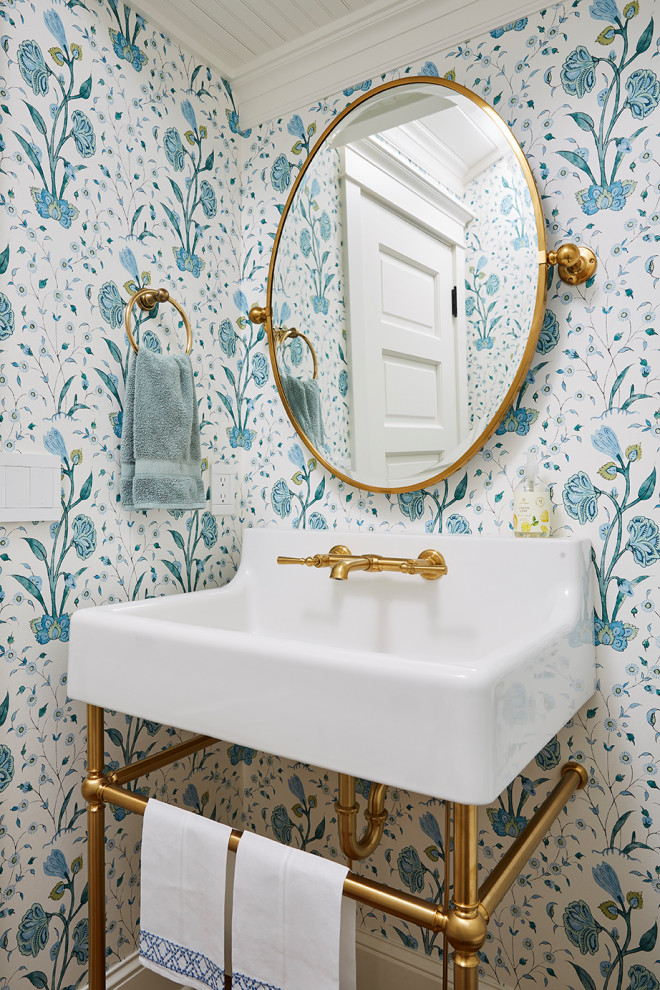Inspiration for a small beach style powder room in Minneapolis with wallpaper.