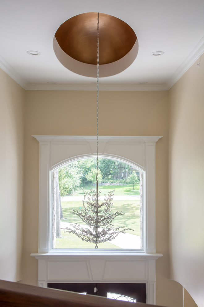 Mid-sized transitional dark wood floor foyer photo in Chicago with beige walls and a dark wood front door