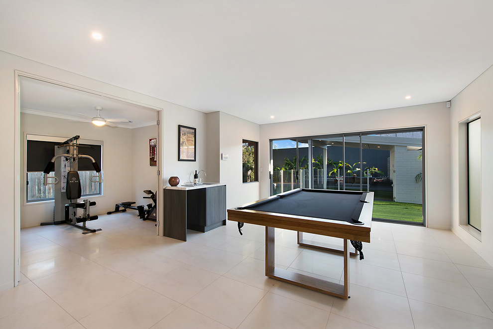 Inspiration for a contemporary enclosed family room in Brisbane with white walls and no tv.