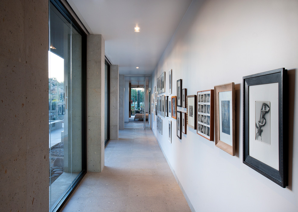 Photo of an expansive contemporary hallway in Phoenix with white walls.