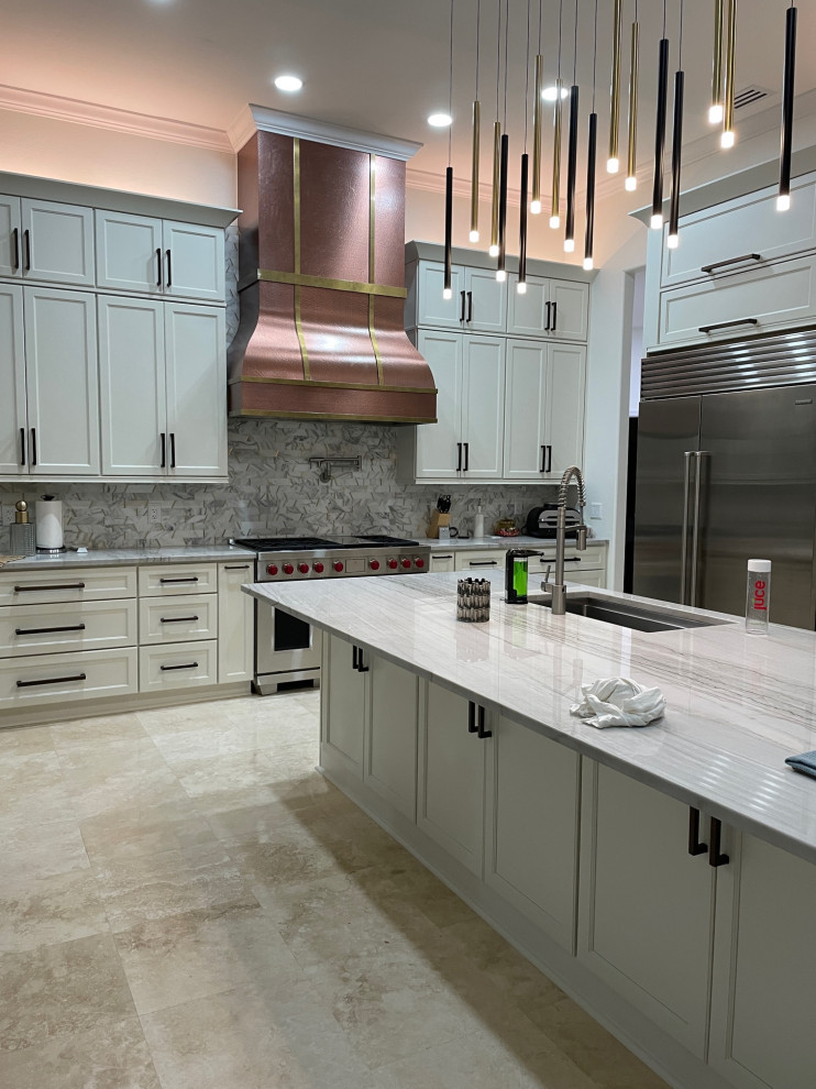 Inspiration for a large contemporary kitchen pantry in Orange County with a drop-in sink, shaker cabinets, white cabinets, quartzite benchtops, white splashback, marble splashback, stainless steel appliances, travertine floors, with island, multi-coloured benchtop and coffered.