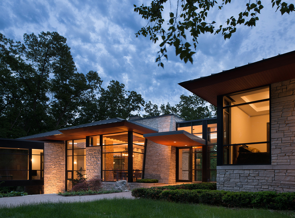 This is an example of a contemporary exterior in Detroit with stone veneer.