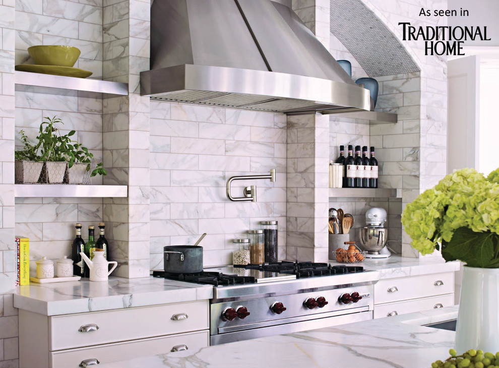 Eat-in kitchen - huge u-shaped marble floor eat-in kitchen idea in New York with an undermount sink, shaker cabinets, white cabinets, marble countertops, white backsplash, stainless steel appliances and an island