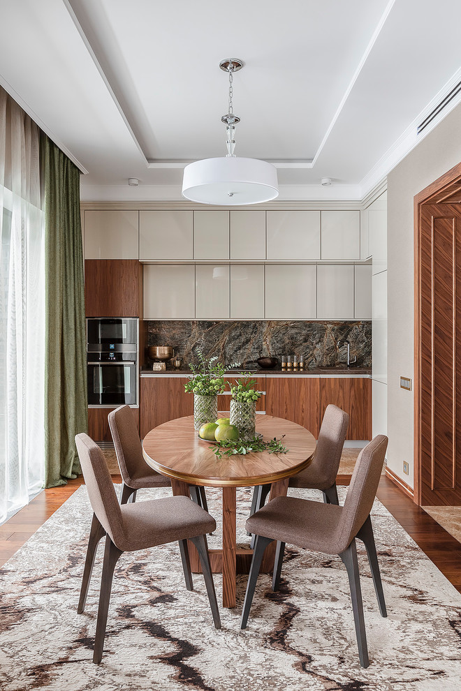 Inspiration for a contemporary single-wall eat-in kitchen in Moscow with flat-panel cabinets, medium wood cabinets, black appliances, dark hardwood floors, brown floor, brown splashback, marble splashback and no island.