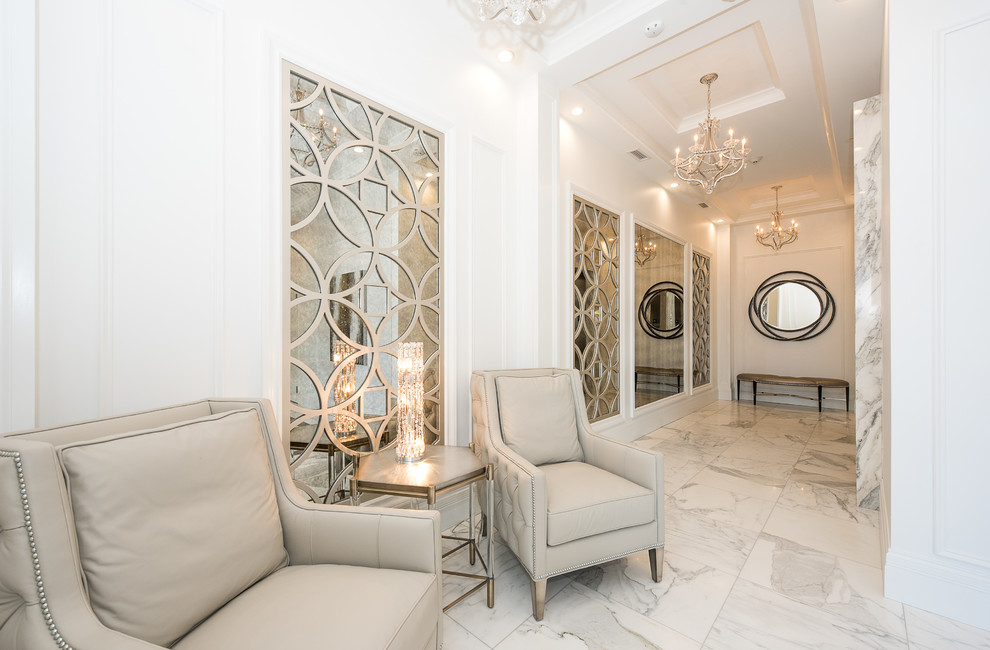Transitional marble floor and white floor single front door photo with white walls and a dark wood front door