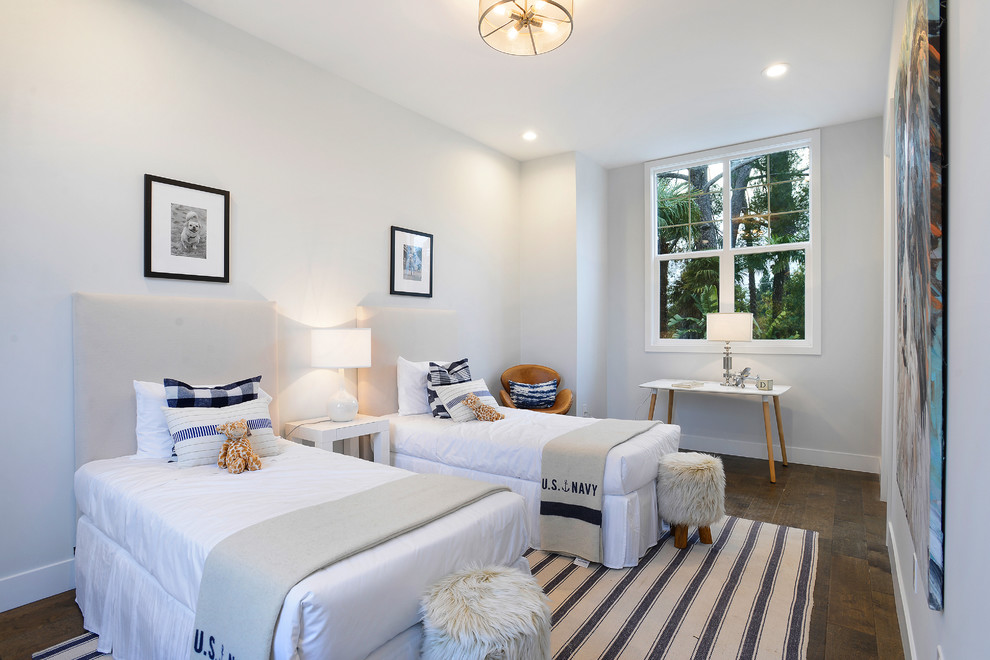 Example of a bedroom transitional boy dark wood floor and brown floor kids' bedroom design in Los Angeles with white walls
