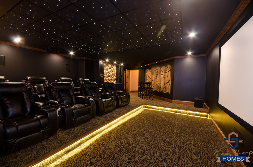 Example of a trendy enclosed carpeted home theater design in Wichita with a projector screen
