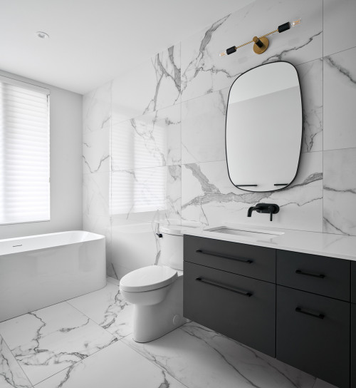 Opulent Retreat: Gray Flat-Panel Cabinets with Marble Tile Walls and Floors for a Stunning Bathroom Vanity