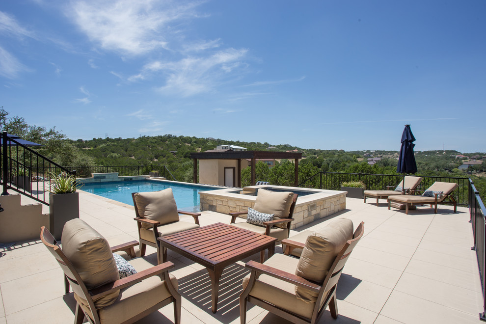 Inspiration for a large transitional backyard concrete and rectangular lap hot tub remodel in Austin