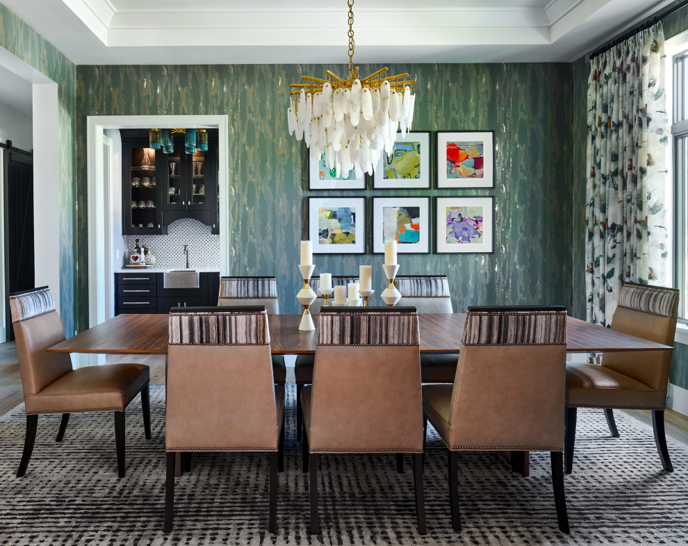 Photo of a traditional dining room in Denver with green walls and wallpapered walls.