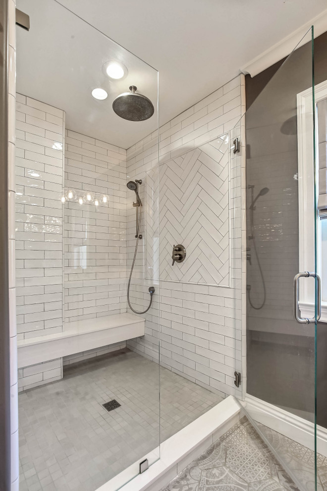 Inspiration for a transitional master bathroom in San Francisco with shaker cabinets, white cabinets, a claw-foot tub, an alcove shower, white tile, subway tile, grey walls, cement tiles, an undermount sink, grey floor, a hinged shower door and white benchtops.