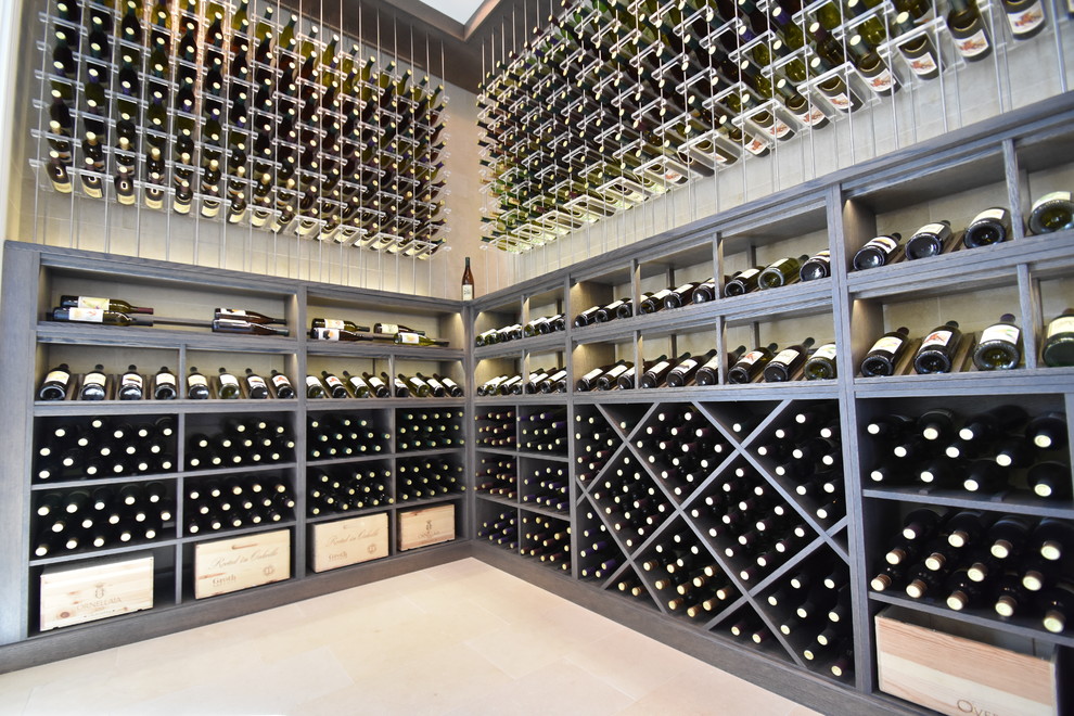 Design ideas for a mid-sized contemporary wine cellar in Orange County with porcelain floors and display racks.