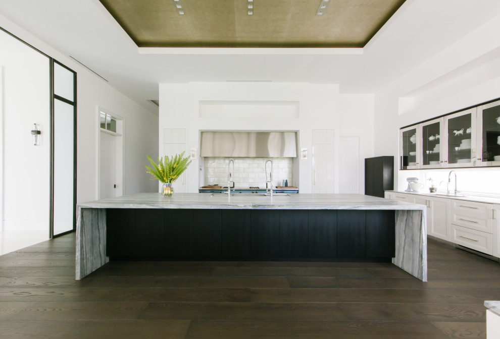 Inspiration for a transitional kitchen remodel in Tampa with an island