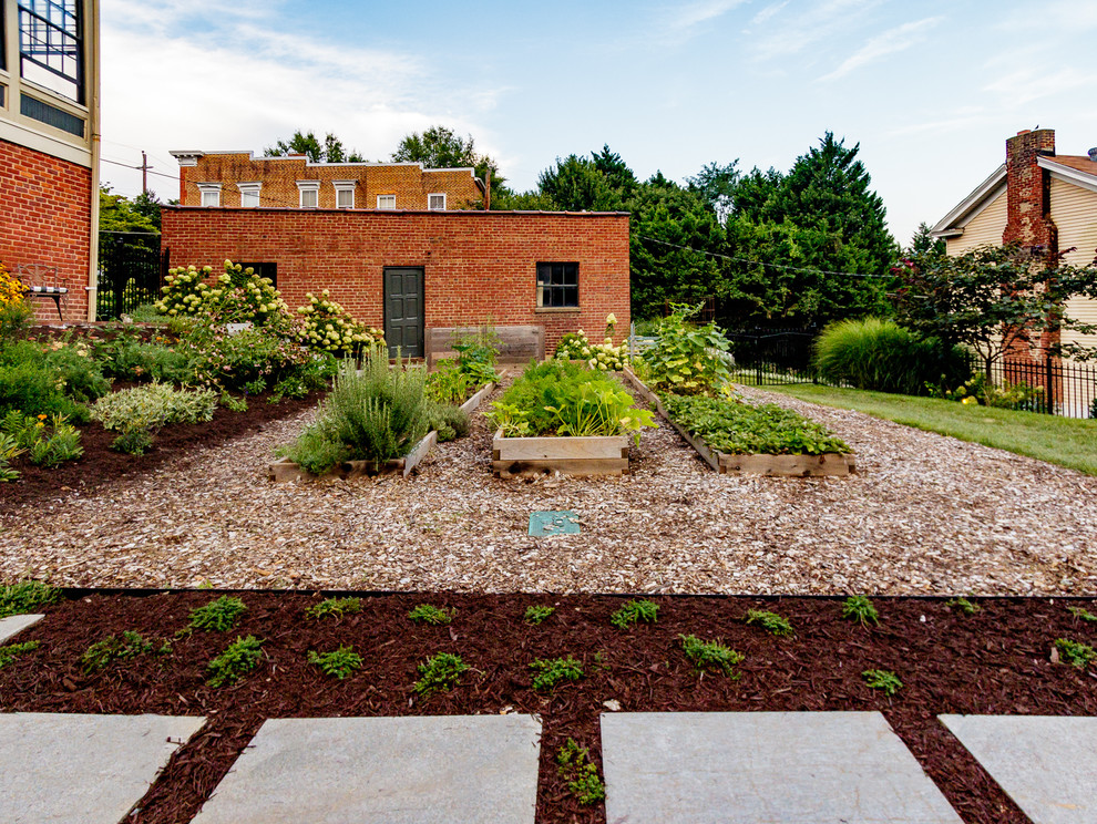 Backyard stone and rectangular hot tub photo