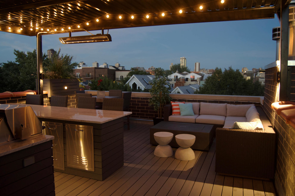 Outdoor kitchen deck - mid-sized transitional rooftop outdoor kitchen deck idea in Chicago with a pergola