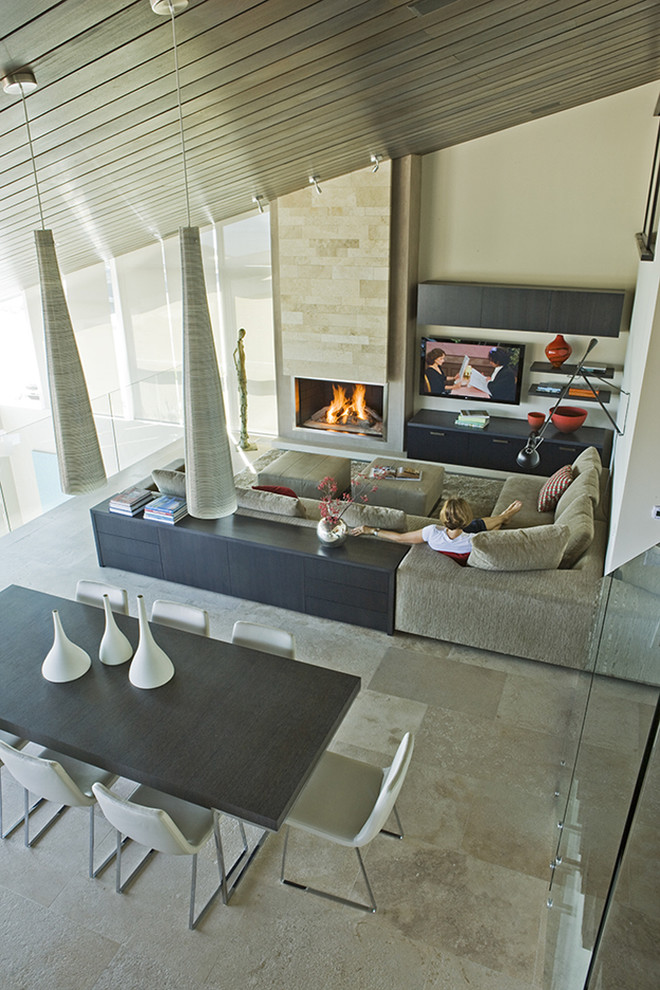 Design ideas for a contemporary open concept family room in Los Angeles with beige walls.