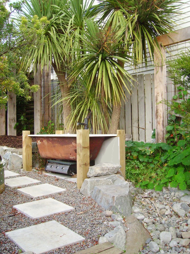 Backyard garden in Wellington with concrete pavers.