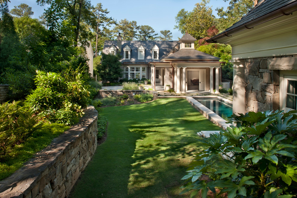 Traditional garden in Atlanta with a retaining wall.