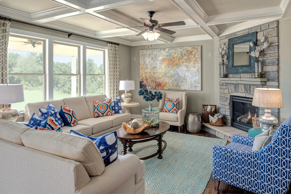 Design ideas for a transitional living room in Atlanta with grey walls, medium hardwood floors, a standard fireplace, a stone fireplace surround and no tv.