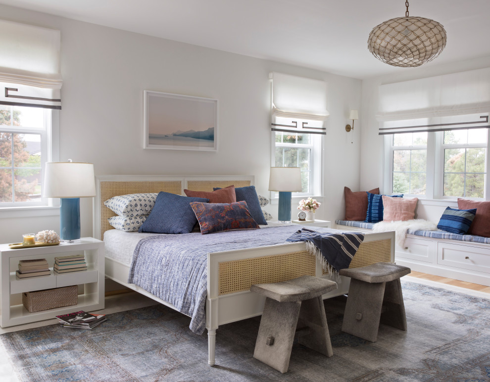 Inspiration for a mid-sized transitional master bedroom in San Francisco with white walls, medium hardwood floors, no fireplace and brown floor.