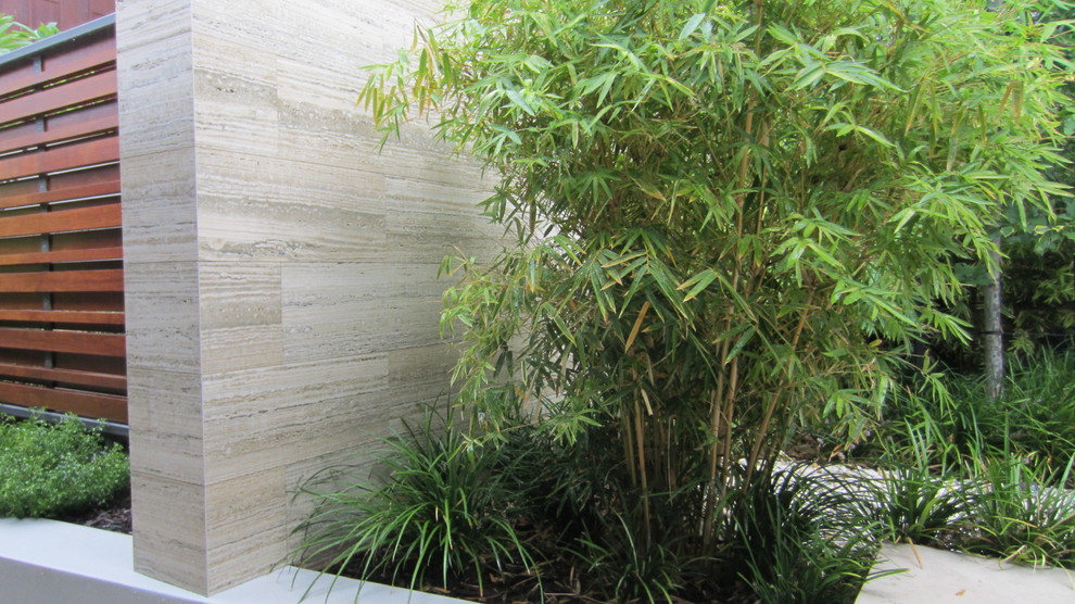 Inspiration for an expansive contemporary courtyard shaded garden in Perth with a garden path and natural stone pavers.