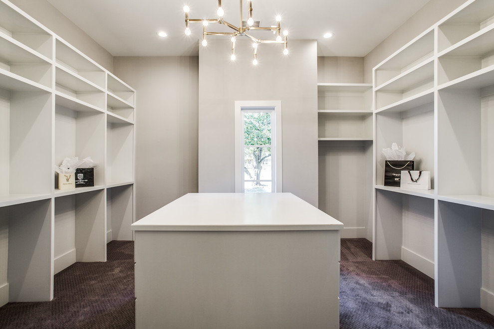 Photo of a large contemporary gender-neutral walk-in wardrobe in Dallas with open cabinets, white cabinets, carpet and purple floor.