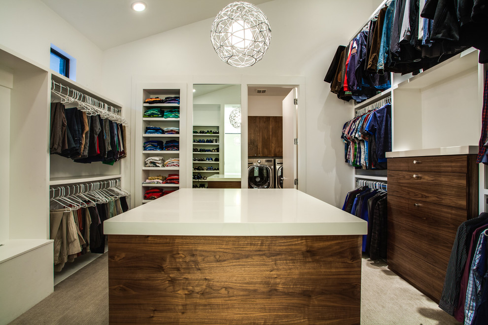 Contemporary storage and wardrobe in Dallas with dark wood cabinets and carpet.